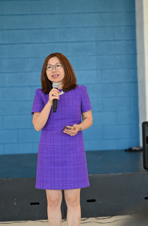 Dr. Helen Tang recites her original work